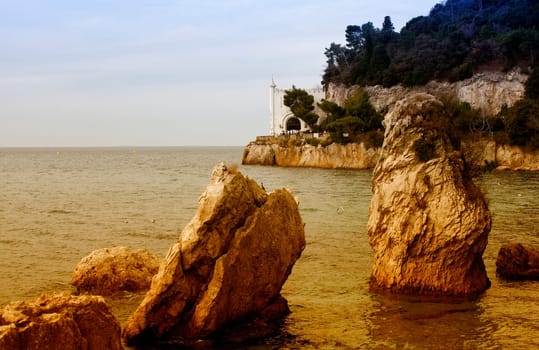 Rock on the sea, Miramare castle. Trieste - Italy