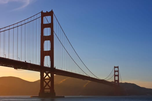 Golden Gate Bridge in the evening in light fog