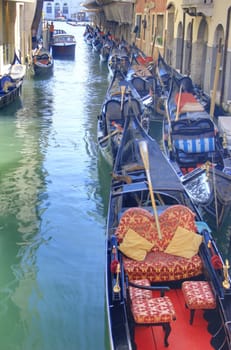 romantic canal in Venice with gondolas