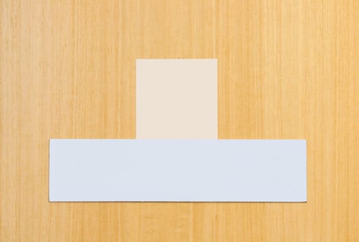 two blank signs on a wooden door (ready for some text or pictures)