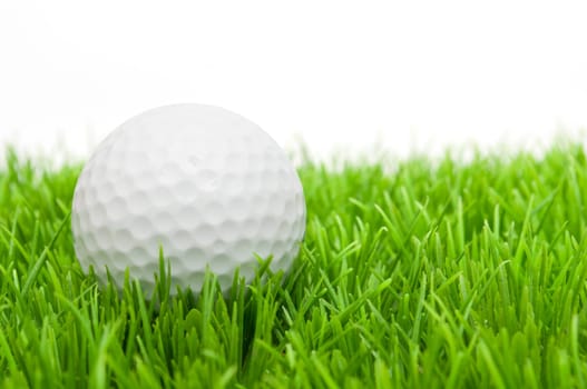 Golf Ball in Grass Isolated on White