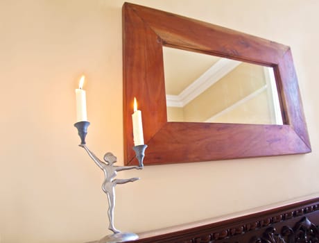 Ballerina Candelabra on the mantelpiece with oak framed mirrorand chimney breast