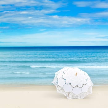 Umbrella on the tropical sandy beach