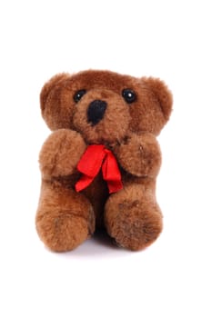 small old teddy bear on a white background