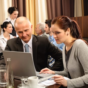 Business people discussion woman look laptop at restaurant conference room