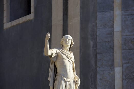 Statue of an ancient religious figure next to the cathedral of Catania