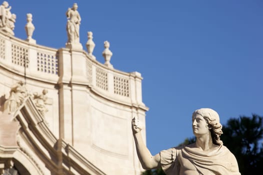 Statue of an ancient religious figure next to the cathedral of Catania