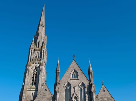 up view of Saint John&#039 s cathedral in Limerick, Ireland (blue sky background)