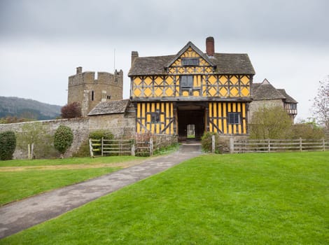 Gatehouse entrance to Stokesay castle on a dark cloudy day