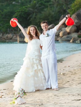 Bride and groom on the beach. Tropical wedding
