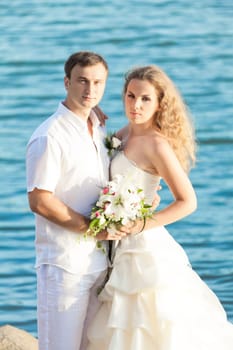 Bride and groom on the beach. Tropical wedding