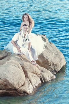 Bride and groom on the beach. Tropical wedding