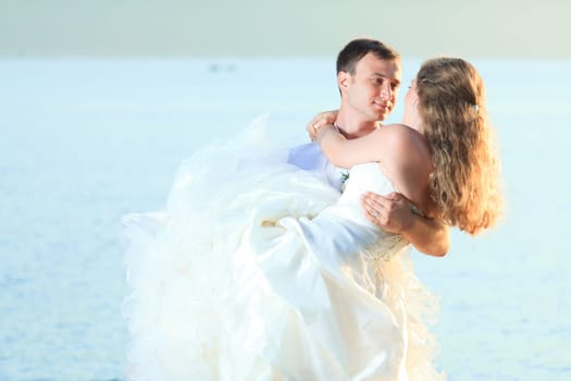 Bride and groom on the beach. Tropical wedding