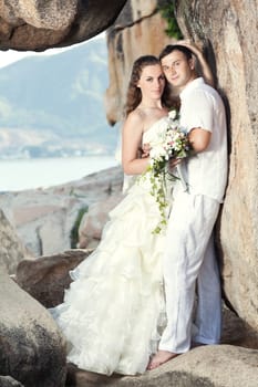 Bride and groom on the beach. Tropical wedding