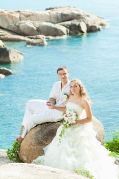 Bride and groom on the beach. Tropical wedding