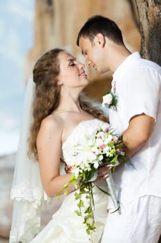 Bride and groom on the beach. Tropical wedding