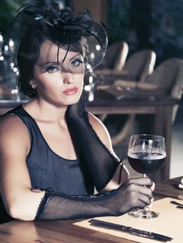 Fashion woman retro portrait in a restaurant