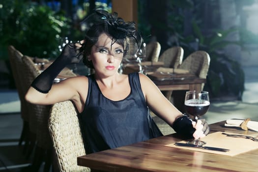 Fashion woman retro portrait in a restaurant