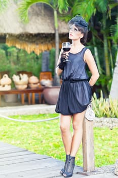 Fashion woman retro portrait with glass of wine