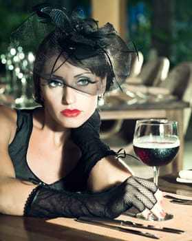 Fashion woman retro portrait in a restaurant