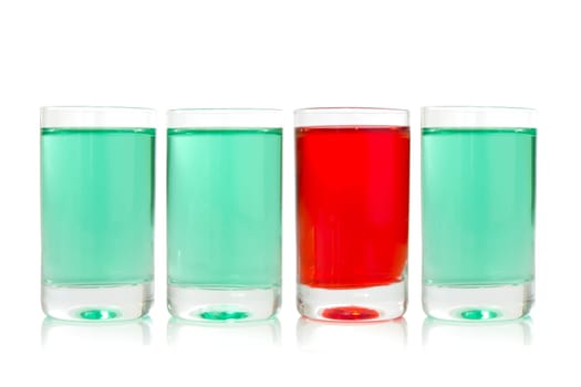 row of glasses with green and red liquid