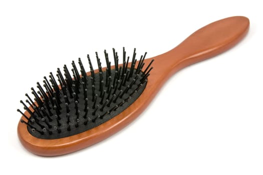 hairbrush with wooden handle on white background