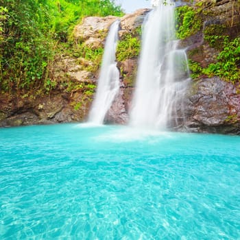 Beautiful waterfall at summer sunny day.