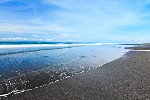 Medewi beach with black volcanic sand