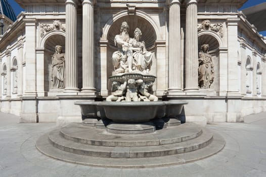 Statue in front of the Albertina,Vienna,with fountain in the inner city