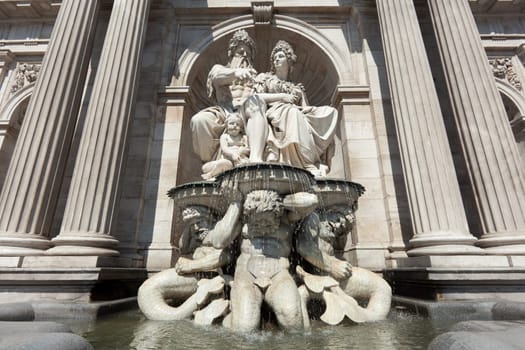 Statue in front of the Albertina,Vienna,with fountain in the inner city