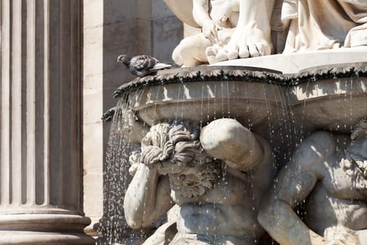 Statue in front of the Albertina,Vienna,with fountain in the inner city