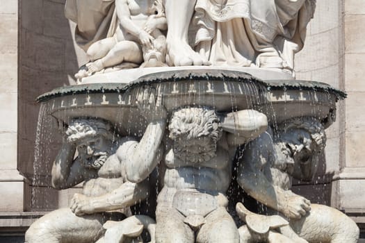 Statue in front of the Albertina,Vienna,with fountain in the inner city