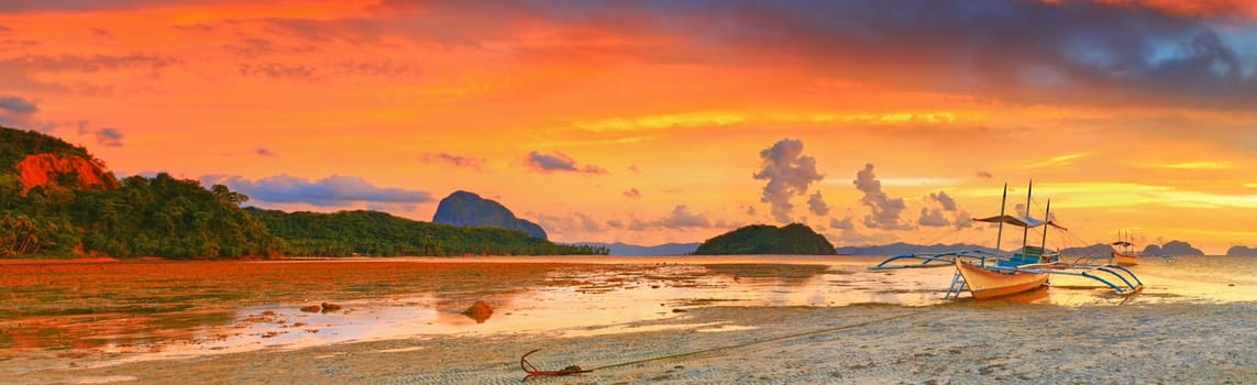 Traditional philippine boat bangka at sunset time