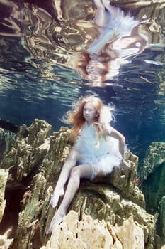 Fashion beautiful woman underwater like a mermaid