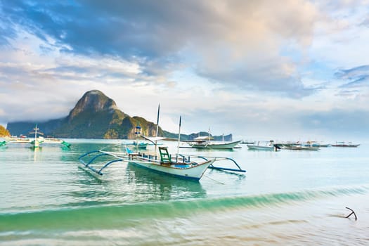 Traditional philippine boats bangka in tropical lagoon