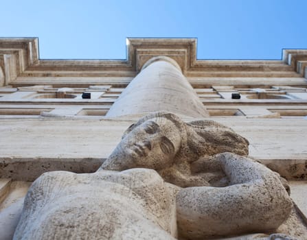 Woman statue of the exchange building of Milan, Italy