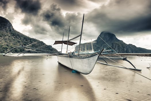 Traditional philippine boat bangka at sunset time