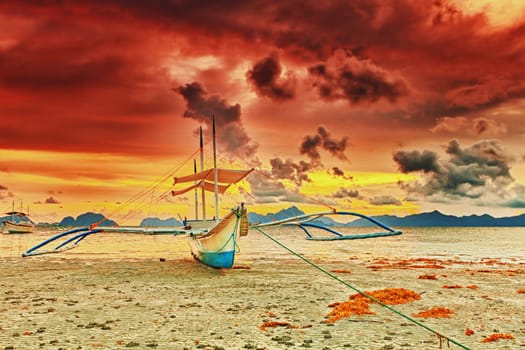 Traditional philippine boat bangka at sunset time