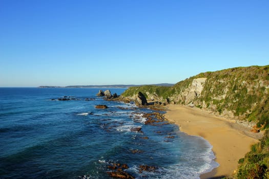 A view from a cliff toward the coastal town of Bermagui, NSW, Australia