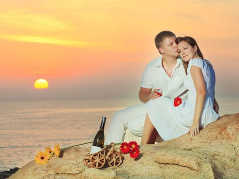 Man proposing to girlfriend and offering engagement ring