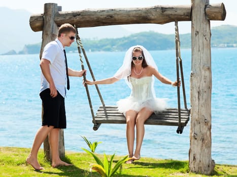 Bride and groom on the tropical beach