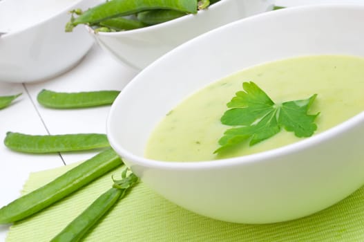Green Creamy Pea Soup in White Bowl