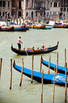 Gondolas parking traditional Venetian rowing boat in Italy