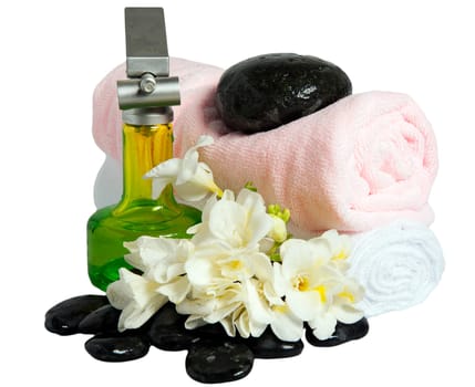 Rocks, flowers, fans and towels on white background