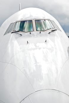 detail of aircraft nose with cockpit window