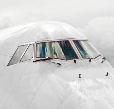 detail of aircraft nose with cockpit window