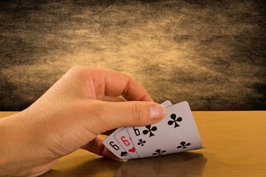 risk and success . Player hand revealing triple six