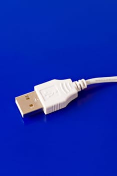 USB connection cable isolated on blue background