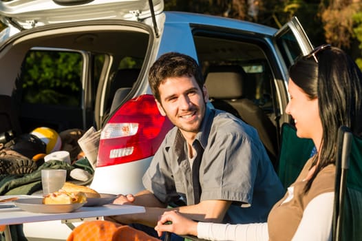 Camping car happy young couple enjoy picnic sunny countryside