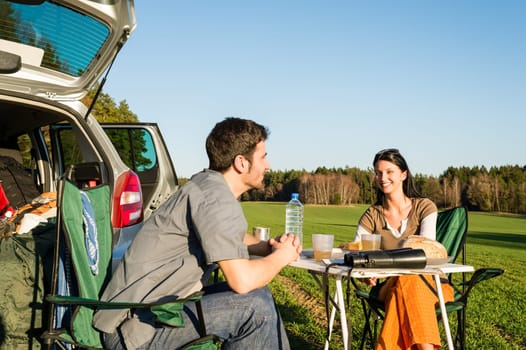 Camping car happy young couple enjoy picnic sunny countryside